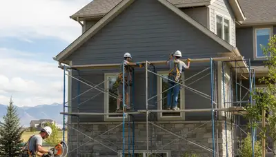 Salt Lake City, UT siding contractor installing durable exterior siding on a home